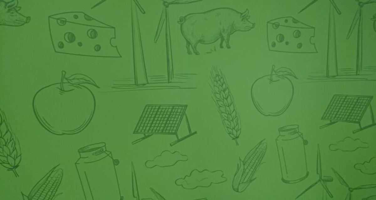 Kühe Käse Äpfel Windräder Solarmodule - Strickzeichnung auf grünem Grund