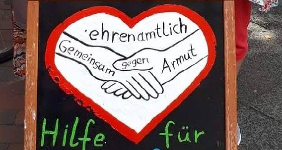 Obdachlosenhilfe WHV Das Logo auf einer Tafel